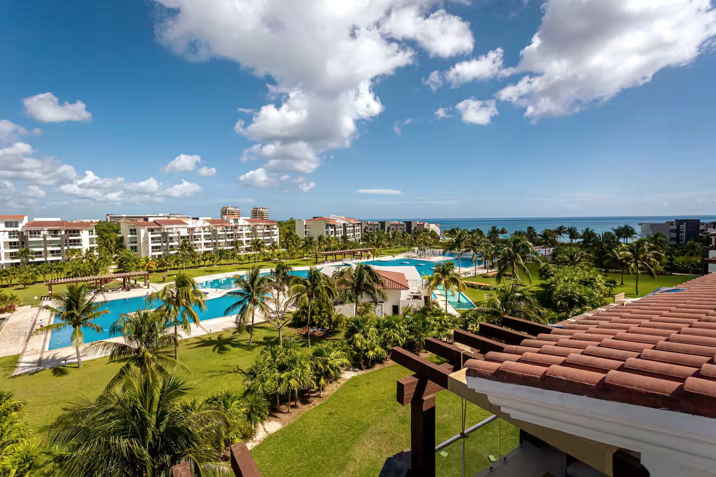 Top-down aerial view of Mareazul's pool, gardens and beach